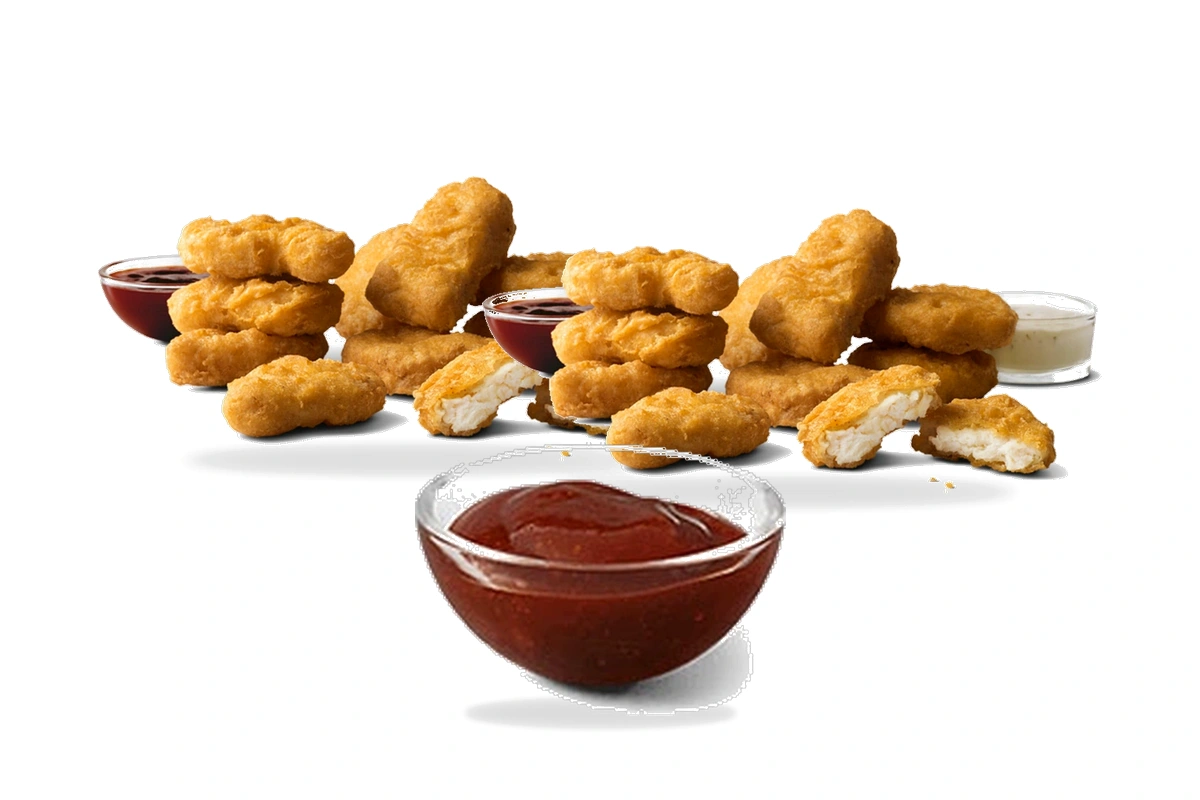 McDonald's 20 Piece Chicken McNuggets with signature dipping sauces on a pure white background