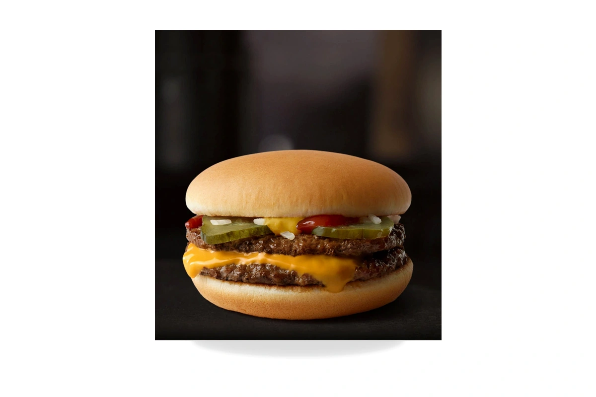 McDonald's McDouble burger with two 100% beef patties, one slice of melted American cheese, pickles, onions, ketchup, and mustard