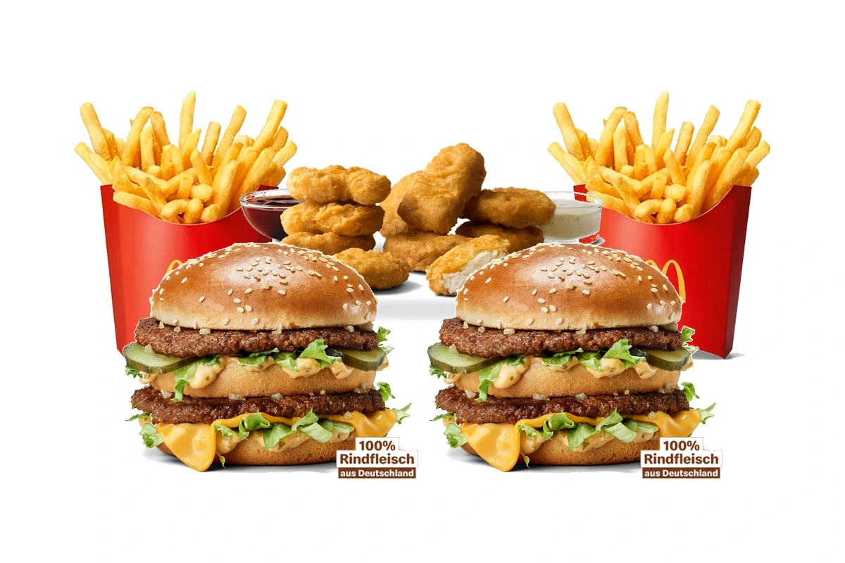 McDonald's Shareables family bundle spread with Two Big Macs, 20-Piece Chicken McNuggets, Two Medium Fries, and dipping sauces